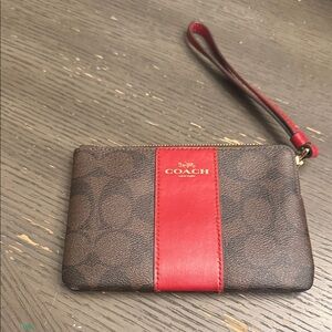 Dark brown and red small coach wristlet